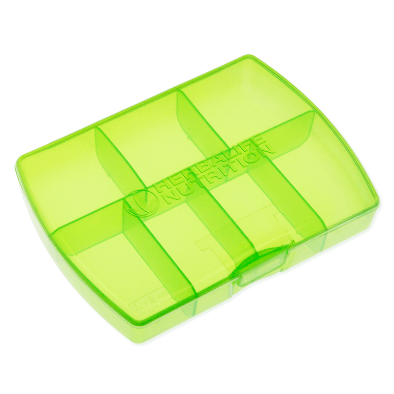 NaturalVive translucent green tablet box with compartments for organization.